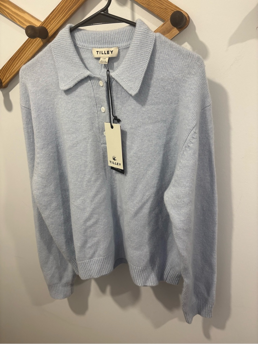 Merino Cashmere Polo featuring a classic ribbed collar -cozy ice-blue
